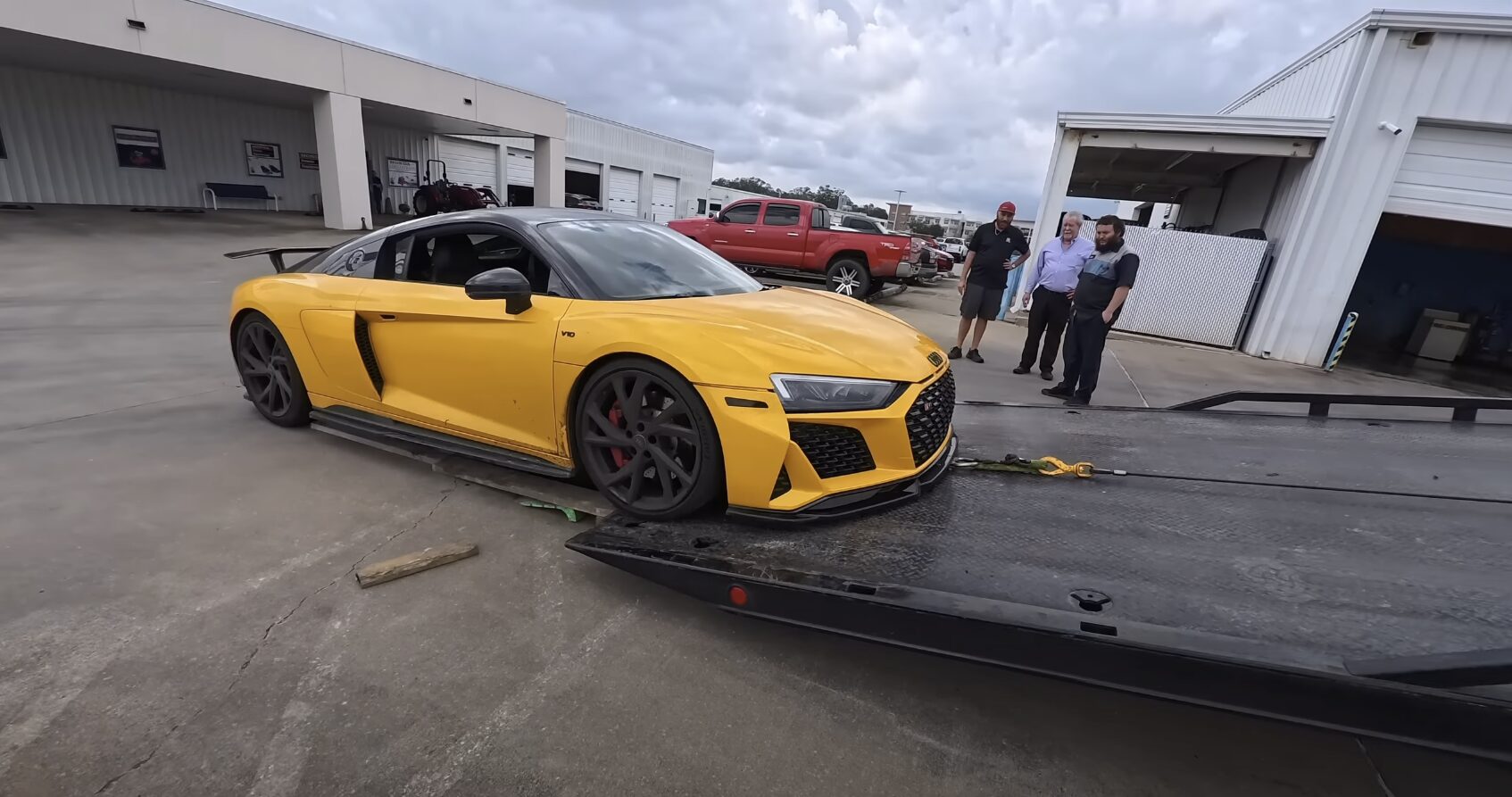 Professional sports car towing service in Palmview, TX showing careful handling